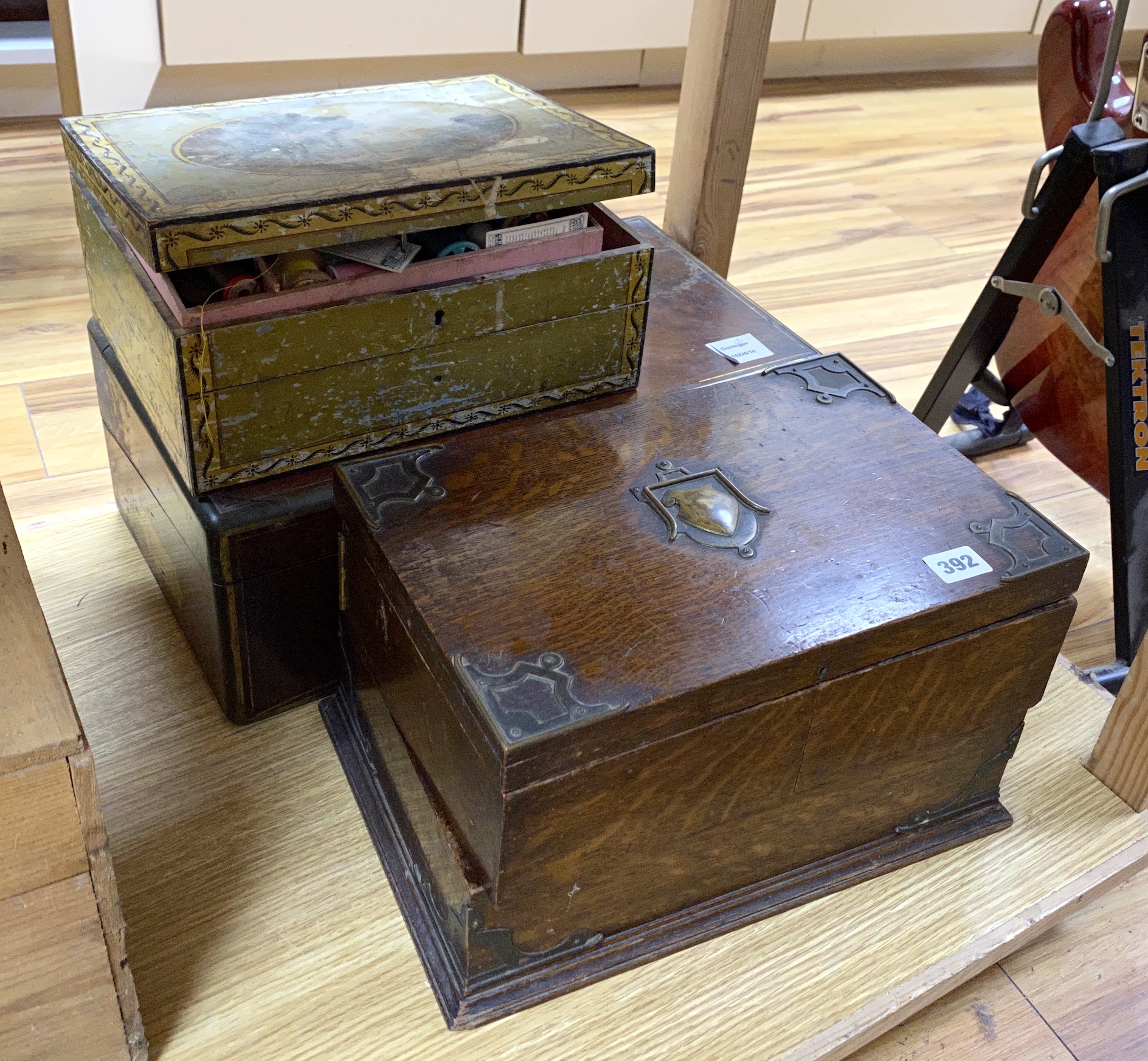 A George III mahogany and brass bound writing slope, a painted sewing box and an oak brass mounted sewing box, (3), writing slope 45cm wide x 26cm deep